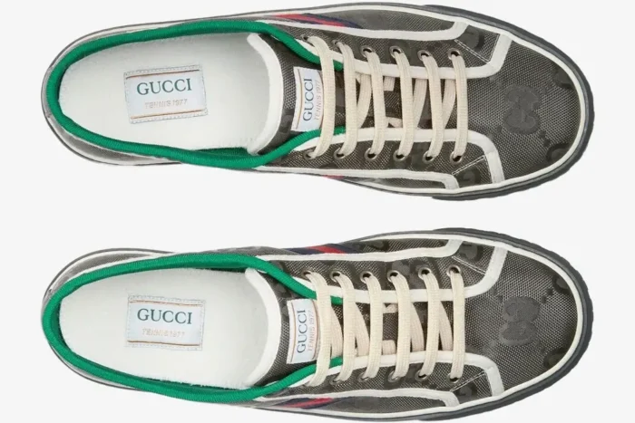 Top-down view of grey Gucci Tennis 1977 Off the Grid low-top sneakers with green trim and white laces. - SKU 628709H9H701161
