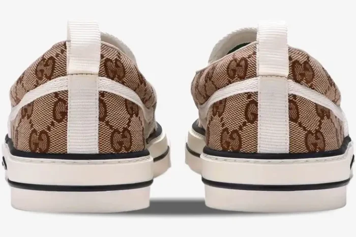 Back view of Gucci Tennis 1977 Slip-On sneakers in brown GG Supreme monogram canvas with white soles. - SKU 643489-2HK30-9761