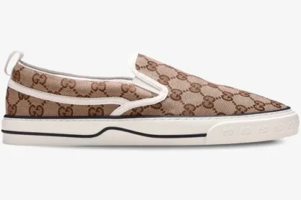 Gucci Tennis 1977 slip-on sneaker in GG Supreme monogram canvas, side profile view. - SKU 643489-2HK30-9761