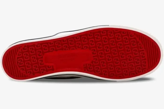 Bottom view of Gucci Tennis 1977 Slip-On shoe featuring a red GG monogram patterned outsole. - SKU 643489-2HK30-9761