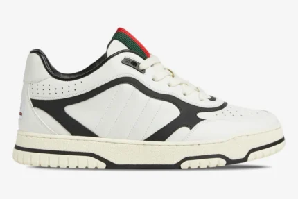 Side view of Gucci Women's Re-Web Sneaker in white and black leather with signature web stripe detail. - SKU 786186AADPM9055