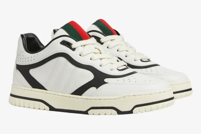 Gucci Women's Re-Web Sneaker in white and black with green and red stripes, side view. - SKU 786186AADPM9055