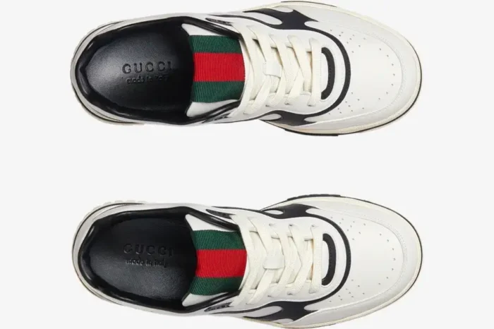Top-down view of Gucci Women's Re-Web Sneakers in white and black with signature green and red web detail. - SKU 786186AADPM9055