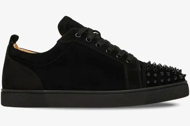 louboutin-louis-junior-spikes-flat-taupe-side-1130575-615-120 Side profile of a black suede Christian Louboutin Louis Junior Spikes Flat sneaker with spiked toe. - SKU 1130575