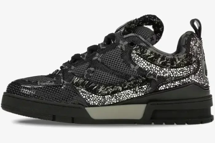 Side profile of a black Louis Vuitton Skate sneaker featuring Swarovski crystal monogram details and frayed edges. - SKU 1ABMHV