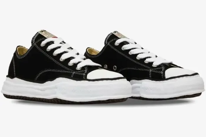 Maison Mihara Yasuhiro Peterson OG Sole Canvas Low in black, three-quarter front view showing warped soles. - SKU A01FW702-BLK