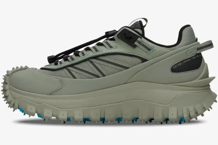 Moncler Trailgrip GTX Sea Grass low top sneakers shown from a side perspective with blue sole accents. - SKU 4M00010-M2058-810