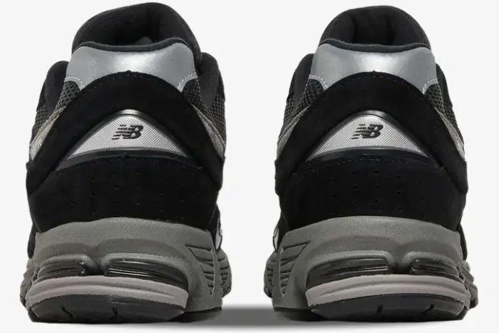 Rear view of New Balance 2002R JD Sports Exclusive sneakers in black and grey suede. - SKU M2002RR1