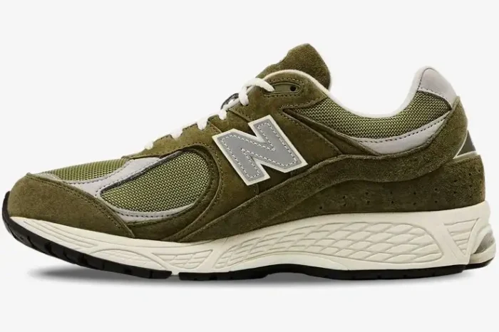 Side view of New Balance 2002R x Footlocker Exclusive sneakers in olive green and grey. - SKU M2002RFO