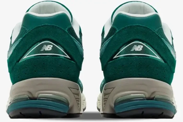 Rear view of New Balance 2002R sneakers in green suede and mesh with grey midsoles. - SKU M2002RG
