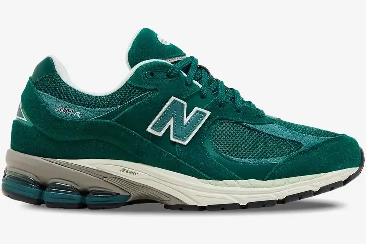 new-balance-2002r-green-suede-side-view-m2002rg-954-370 Side view of a New Balance 2002R sneaker featuring green suede and mesh panels with a white N logo. - SKU M2002RG