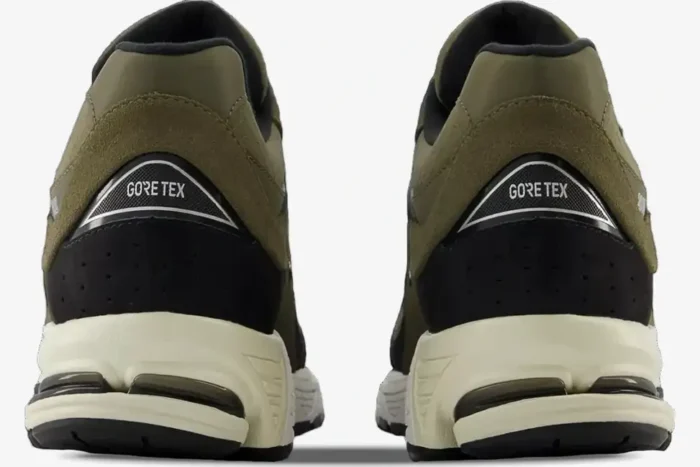 Rear view of New Balance 2002R Olive Black sneakers featuring GORE-TEX branding on the heel. - SKU M2002RXU