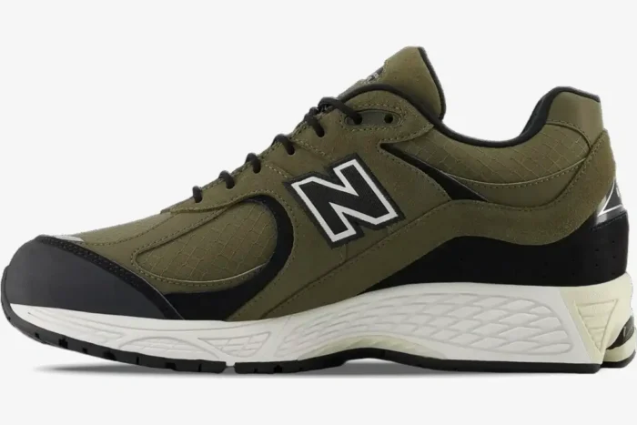 New Balance 2002R 'Olive Black' premium suede sneakers shown from a side profile perspective. - SKU M2002RXU