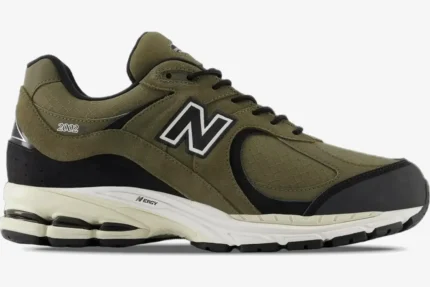 Side view of New Balance 2002R 'Olive Black' Premium Suede sneakers with olive green and black panels. - SKU M2002RXU