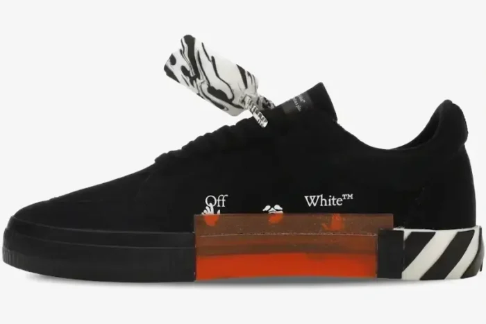Off-White Low Vulcanized black sneakers with white logo and orange sole detail, side profile view. - SKU OWIA272C99LEA0011001