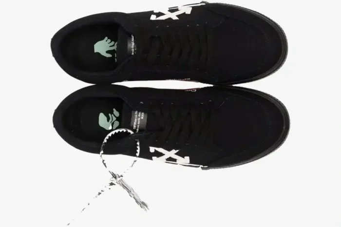 Top-down view of Off-White Low Vulcanized black and white sneakers with signature zip tie. - SKU OWIA272C99LEA0011001