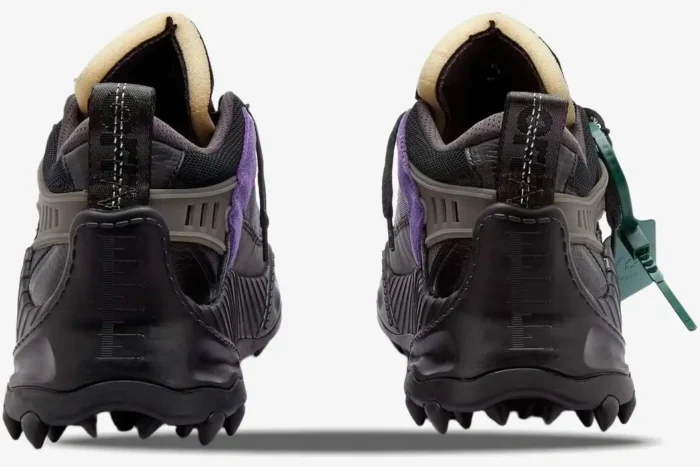 Rear view of Off-White ODSY-1000 Black 2023 sneakers with purple accents and spiked soles. - SKU OWIA180C99FAB001-1000