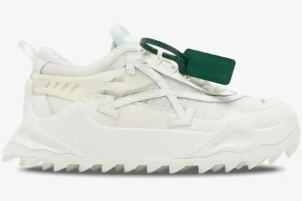 Side view of Off-White ODSY-1000 white chunky sneakers with spiked soles and a green zip tie. - SKU OMIA139C99FAB001-0100