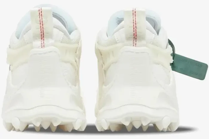 Rear view of Off-White ODSY-1000 white chunky sneakers with spiked soles and signature green zip tie tag. - SKU OMIA139C99FAB001-0100