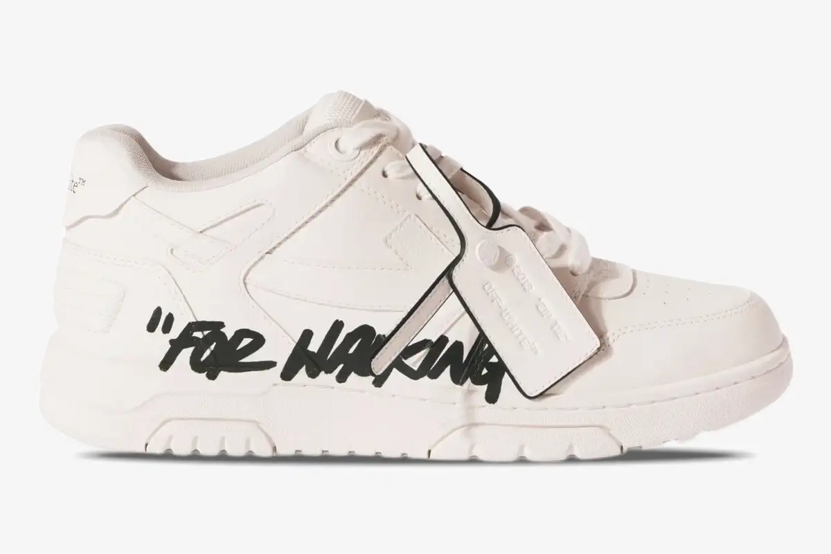 off-white-out-of-office-for-walking-side-view-omia189c99lea0010110-337-462 Side profile of Off-White Out Of Office 'For Walking' sneakers in white with black text and zip tie. - SKU OMIA189C99LEA0010110