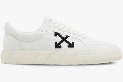 Side view of white Off-White Vulcanized Low Canvas sneakers with a black arrow logo and cream sole. - SKU OMIA085C99FAB0070110