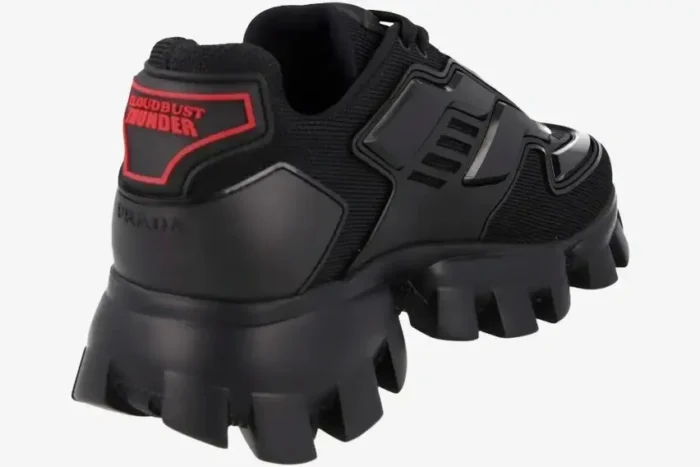 Rear view of Prada Cloudbust Thunder black knit sneakers with chunky sculptural soles and red heel logo. - SKU 2EG293-3KZU-F0002