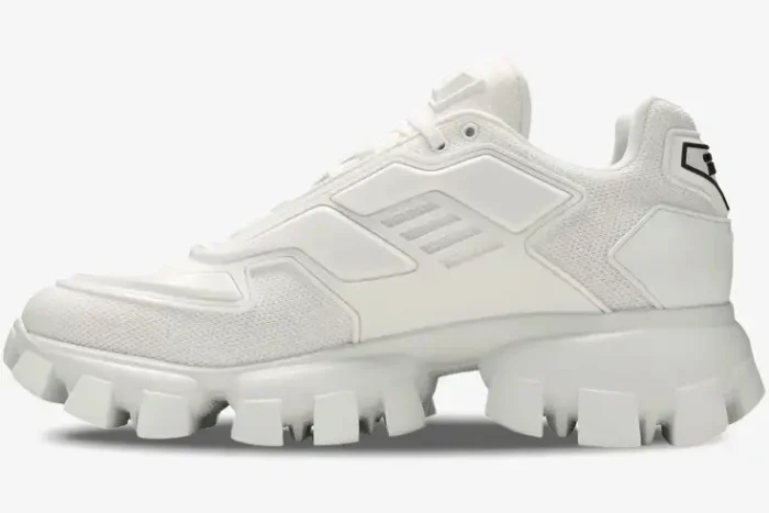Side profile of white Prada Cloudbust Thunder Knit sneakers featuring a chunky lug sole and rubber overlays. - SKU 2EG293-3KZU-F0009