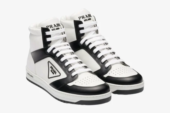 Prada District high top leather sneakers in white and black, three-quarter front view. - SKU 2TE182-3LJ6-F0964