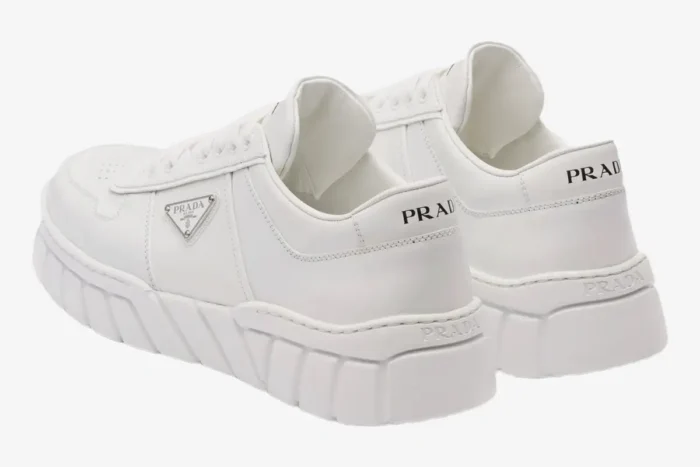 Rear view of white Prada low top sneakers with geometric tread and logo details. - SKU 2EE3783LJ6F0009